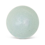 A carved Qingbai 'boys' bowl, Northern Song dynasty | 北宋 青白釉刻連生貴子紋斗笠盌