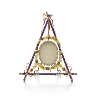 View full screen - View 1 of Lot 1046. A jewelled vari-colour gold and silver enamel easel picture frame in the manner of Fabergé, circa 1980.