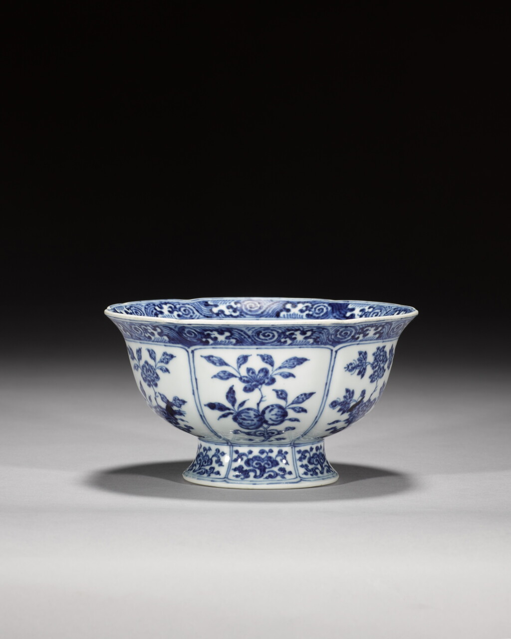 View full screen - View 1 of Lot 154. A blue and white 'sanduo' lobed bowl, Mark and period of Yongzheng | 清雍正 青花三多紋葵口盌《大清雍正年製》款.