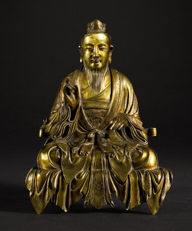 View full screen - View 1 of Lot 187. A RARE GILT-BRONZE SEATED FIGURE OF A DAOIST DEITY QING DYNASTY, 18TH CENTURY | 清十八世紀 鎏金銅道教神仙坐像.