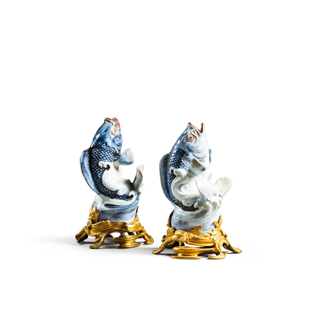 View full screen - View 1 of Lot 21. A pair of Louis XV gilt-bronze mounted Japanese Arita porcelain carps, early 18th and circa 1750 | Paire de carpes en porcelaine Arita, Japon, du début du XVIIIe siècle, monture de bronze doré d’époque Louis XV, vers 1750.