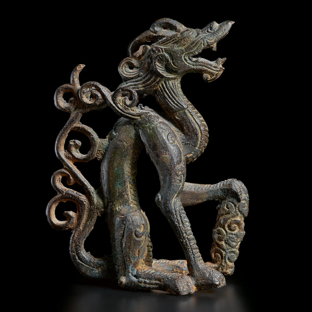 View full screen - View 1 of Lot 200. A rare bronze figure of a crouching dragon, Jin dynasty | 金 銅坐龍.