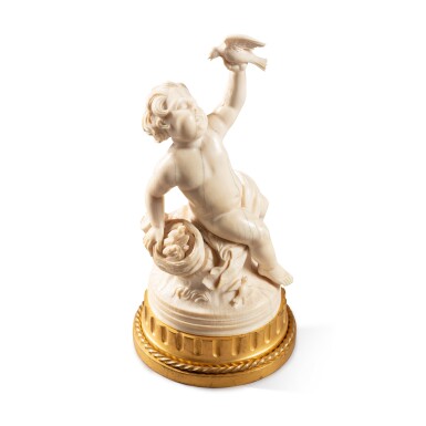 View full screen - View 1 of Lot 504. A French ivory seated Putto holding a bird, Late 18th / early 19th century.