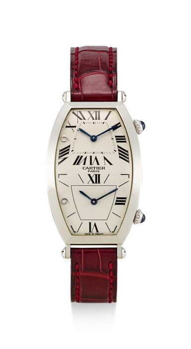 View full screen - View 1 of Lot 8231. CARTIER | COLLECTION PRIVÉE - TONNEAU TWO TIME ZONES, REFERENCE 2487, A LIMITED EDITION PLATINUM DUAL TIME ZONE WRISTWATCH, MADE TO COMMEMORATE MACAU'S HANDOVER TO THE PEOPLE'S REPUBLIC OF CHINA, MADE IN 1999.