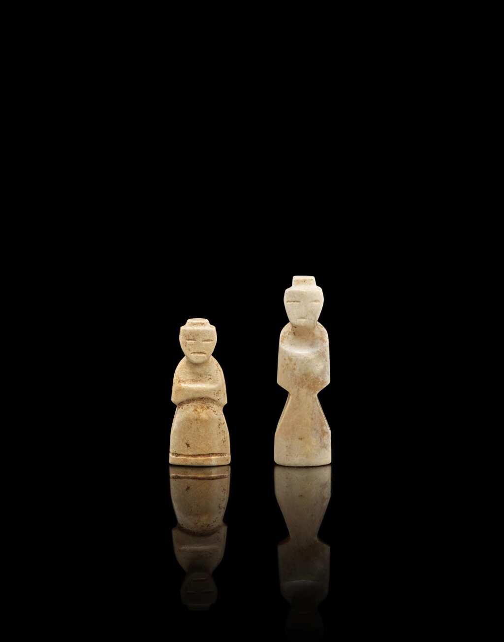 View full screen - View 1 of Lot 3764. Two jade 'figure' pendants, wengzhong, Han dynasty | 漢 玉翁仲珮兩枚.