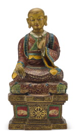 A LARGE POLYCHROME CLAY FIGURE OF A LUOHAN, QING DYNASTY, 18TH CENTURY | 清十八世紀 陶製彩繪羅漢坐像