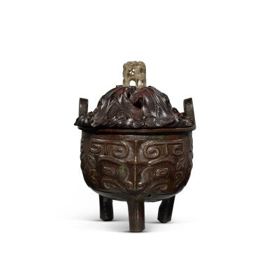 View full screen - View 1 of Lot 696. An archaistic gold and silver-inlaid bronze tripod censer, Ming dynasty | 明 銅錯金銀獸面紋三足爐.