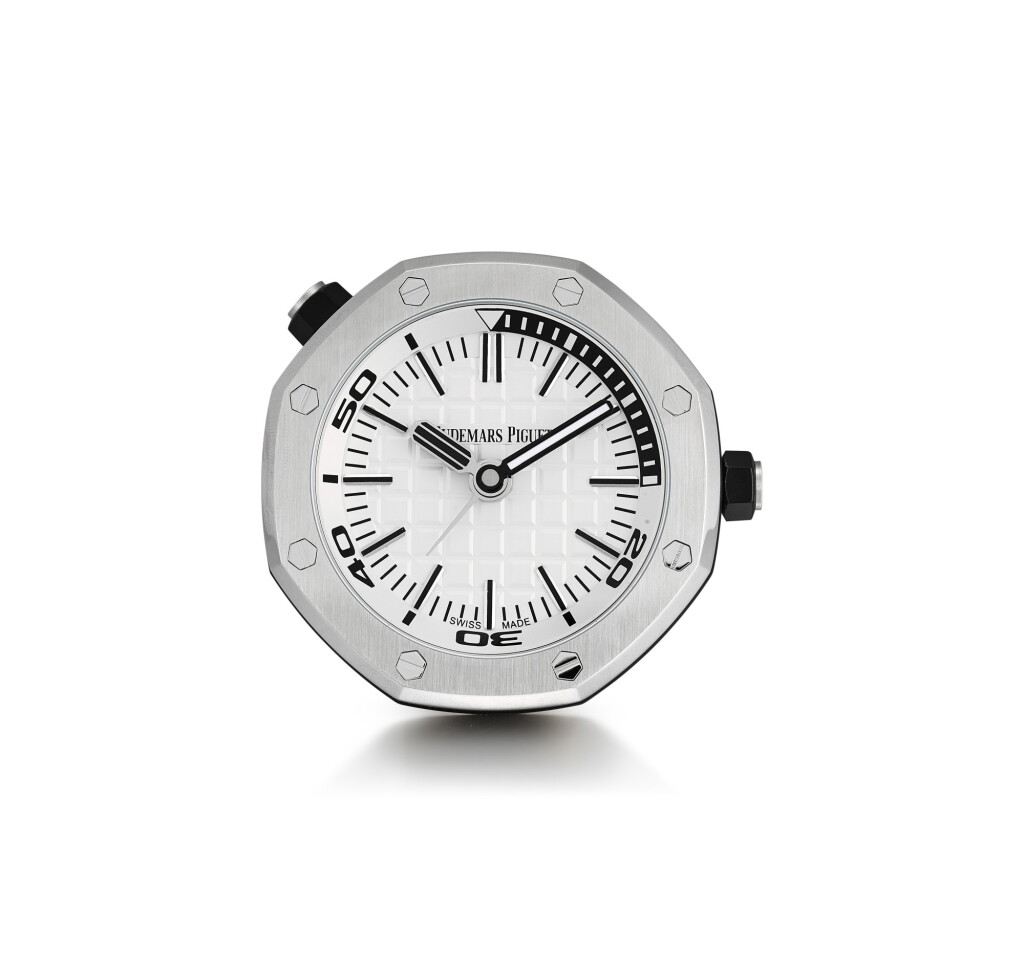 View full screen - View 1 of Lot 204. AUDEMARS PIGUET | ROYAL OAK, A BRAND NEW STAINLESS STEEL ALARM DESK CLOCK WITH WOODEN STAND, CIRCA 2016.