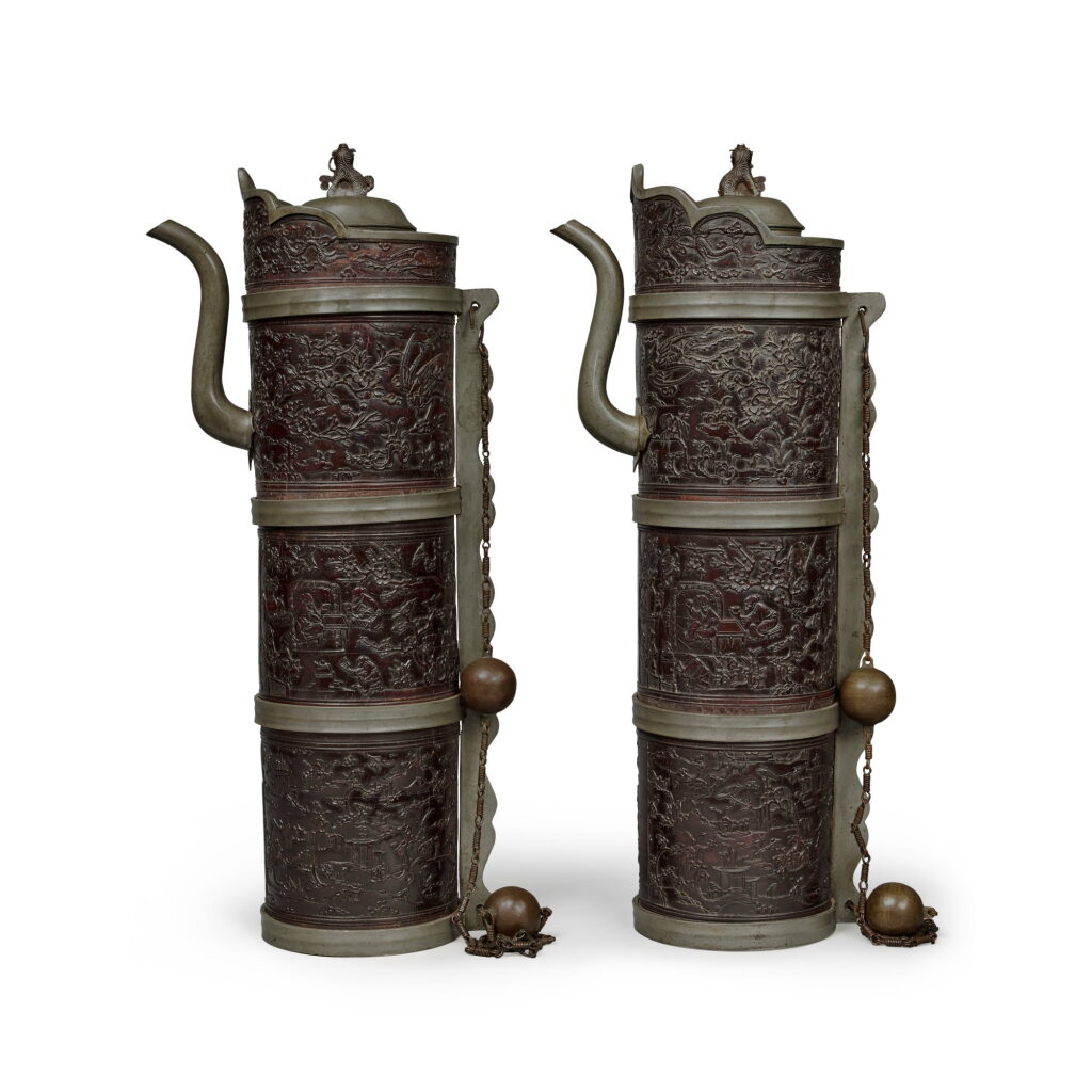 View full screen - View 1 of Lot 342. A rare pair of coconut shell pewter-mounted Tibetan-style ewers (Duomuhu), Qing dynasty, 18th century | 清十八世紀 鑲錫椰殼雕花鳥山水煎茶圖多穆壺一對.