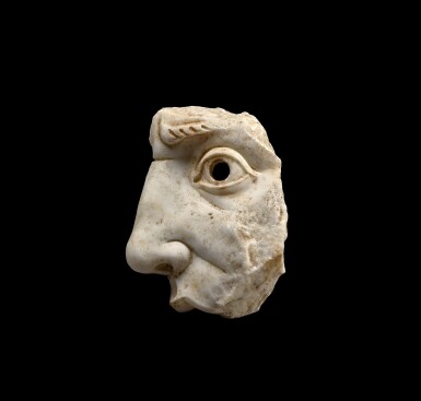 View full screen - View 1 of Lot 153. A Roman Marble Mask Fragment, circa 2nd Century A.D..