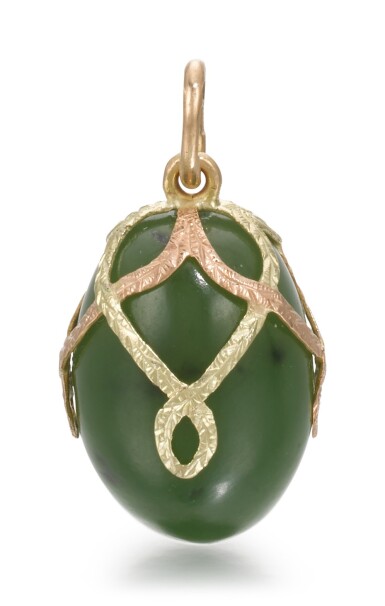 View full screen - View 1 of Lot 57. A Fabergé two-colour gold-mounted and nephrite egg pendant, workmaster Fedor Afanasiev, St Petersburg, 1899-1904.