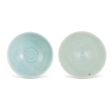 View full screen - View 1 of Lot 1011. A carved Qingbai 'fish' bowl and a carved Qingbai 'crane' bowl, Southern Song dynasty | 南宋 青白釉刻雙魚紋 及 壽鶴紋斗笠盌一組兩件.