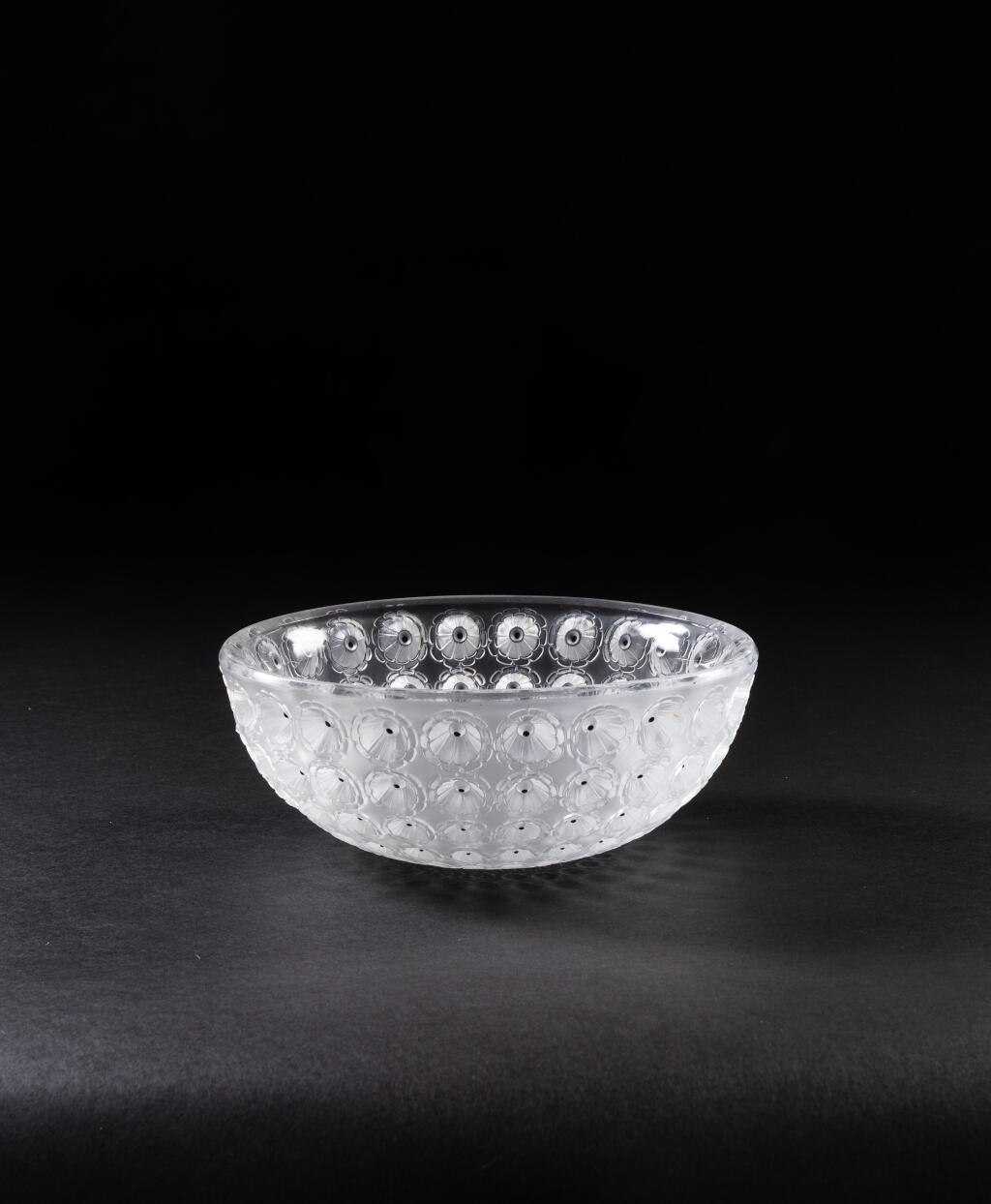 View full screen - View 1 of Lot 264. A pressed white glass and black enamel fruit bowl, Lalique France, the model created in 1929.