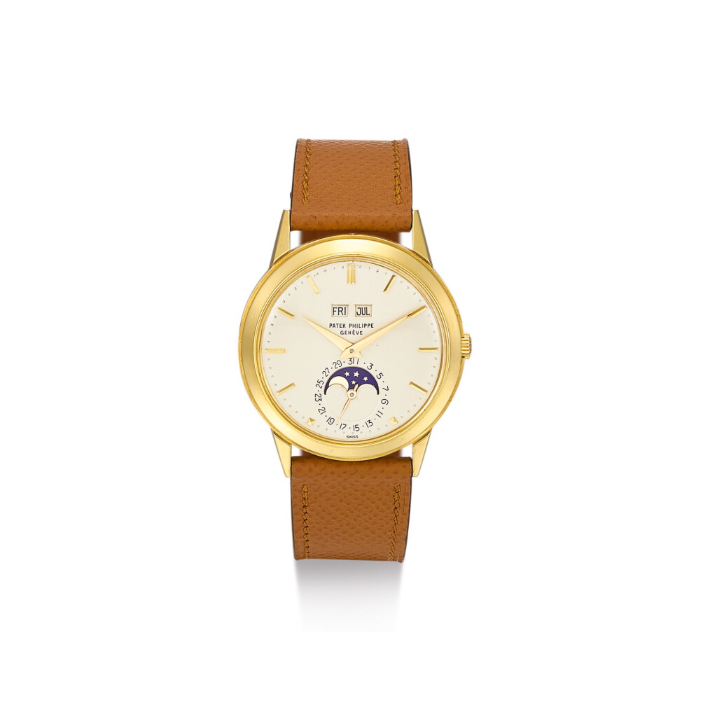 View full screen - View 1 of Lot 1009. PATEK PHILIPPE | REF 3448, A YELLOW GOLD PERPETUAL CALENDAR WRISTWATCH WITH MOON PHASES HARD ENAMEL SIGNATURE AND PEARL MINUTE MARKERS, MADE IN 1970 | 百達翡麗 | 3448型號黃金萬年曆腕錶備月相顯示、琺瑯錶盤及珍珠分鐘時標,1970年製.