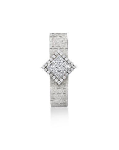 View full screen - View 1 of Lot 1986. Reference 2405 A6 A white gold and diamond-set bracelet watch with concealed dial, Circa 1980.
