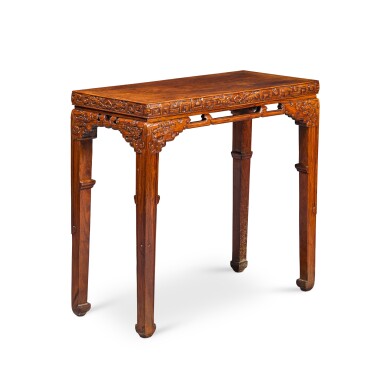 View full screen - View 1 of Lot 3688. A finely carved and exceedingly rare huanghuali 'dragon' side table, Qing dynasty, Kangxi period | 清康熙 黃花梨束腰馬蹄足夔龍紋條桌.