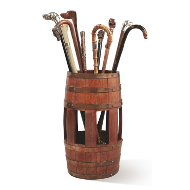 View full screen - View 1 of Lot 5. A BARREL-FORM OAK UMBRELLA STAND TOGETHER WITH A SELECTION OF TEN WALKING STICKS .