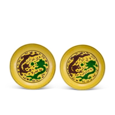 View full screen - View 1 of Lot 341. A pair of yellow-ground green and aubergine 'dragon' dishes Marks and period of Guangxu | 清光緒 黃地紫綠彩雲龍紋盤一對 《大清光緒年製》款.