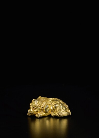 View full screen - View 1 of Lot 176. A rare gilt-bronze 'mythical beast' weight, Ming dynasty, early 15th century.