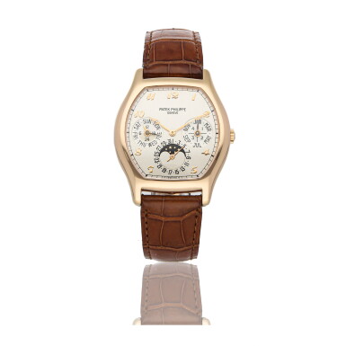View full screen - View 1 of Lot 316. PATEK PHILIPPE | REF 5040R, A ROSE GOLD TONNEAU-SHAPED AUTOMATIC PERPETUAL CALENDAR WRISTWATCH WITH MOON PHASES CIRCA 2000.