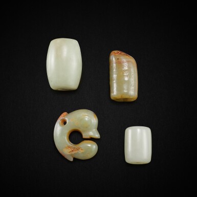 View full screen - View 1 of Lot 3003. A celadon jade 'pig dragon' pendant and three jade beads, Neolithic period 新石器時期 青玉豬龍珮一件及玉管三件.