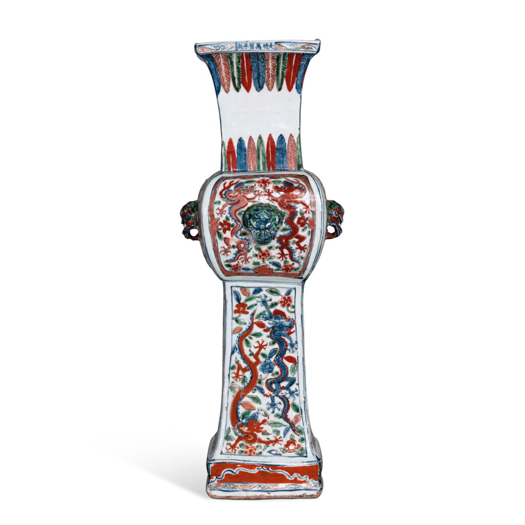 View full screen - View 1 of Lot 239. An extremely rare molded wucai 'dragon' zun-form vase, Mark and period of Wanli | 明萬曆 五彩穿花龍紋鋪首大方尊 《大明萬曆年製》款.