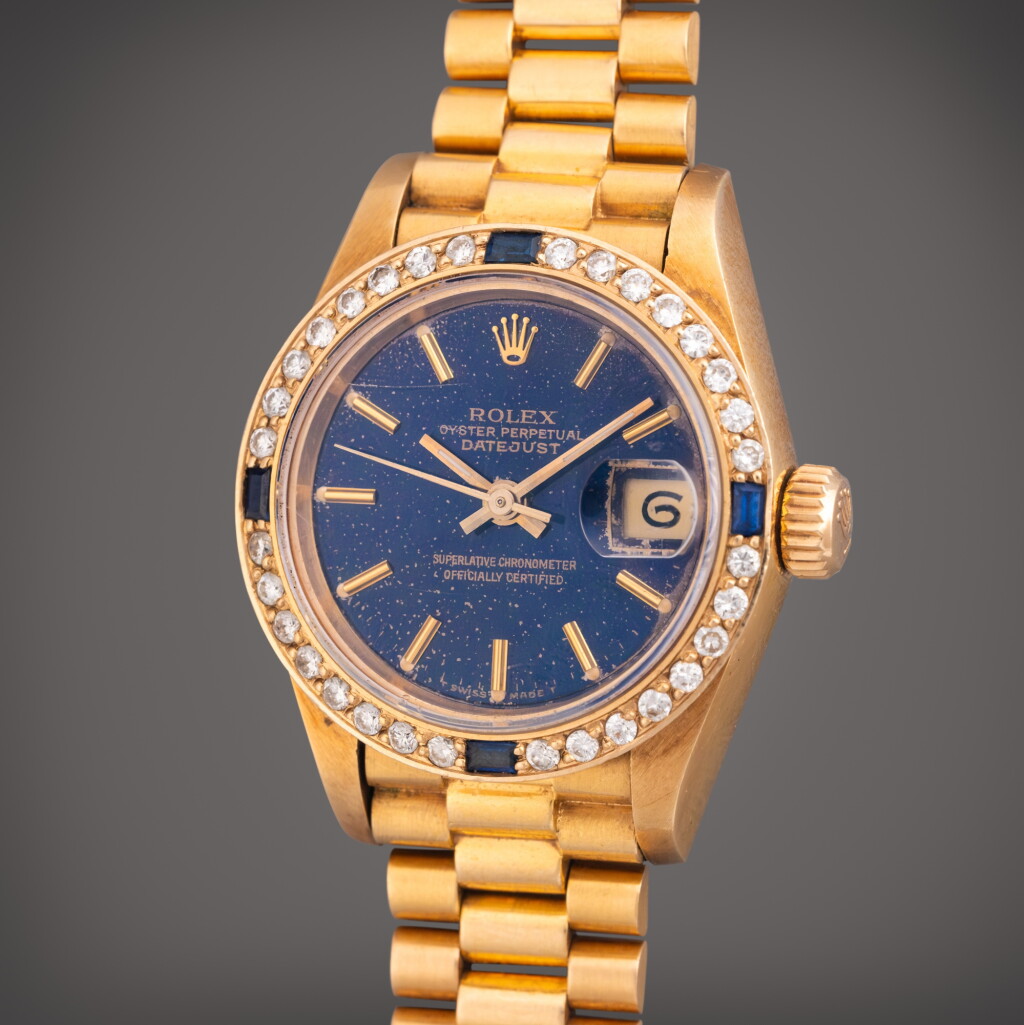 View full screen - View 1 of Lot 395. Reference 69178 Datejust | A yellow gold, diamond, and sapphire-set automatic wristwatch with date and bracelet, Circa 1990.
