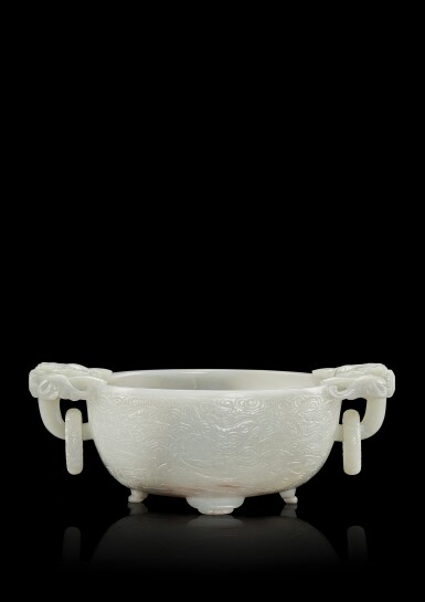 View full screen - View 1 of Lot 3618. A white jade 'dragon' marriage bowl, Qing dynasty, Qianlong period | 清乾隆 白玉雕雲蝠雙龍活環耳洗.