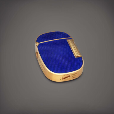 View full screen - View 1 of Lot 643. Golden Ellipse, Reference 9507 | A yellow gold and blue enamel lighter | Circa 1978.