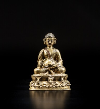 View full screen - View 1 of Lot 9. A silver and copper-inlaid copper alloy figure of Padampa Sanggye, Tibet, 15th / 16th century | 十五 / 十六世紀 藏傳銅合金錯銀銅當巴桑傑大師坐像.