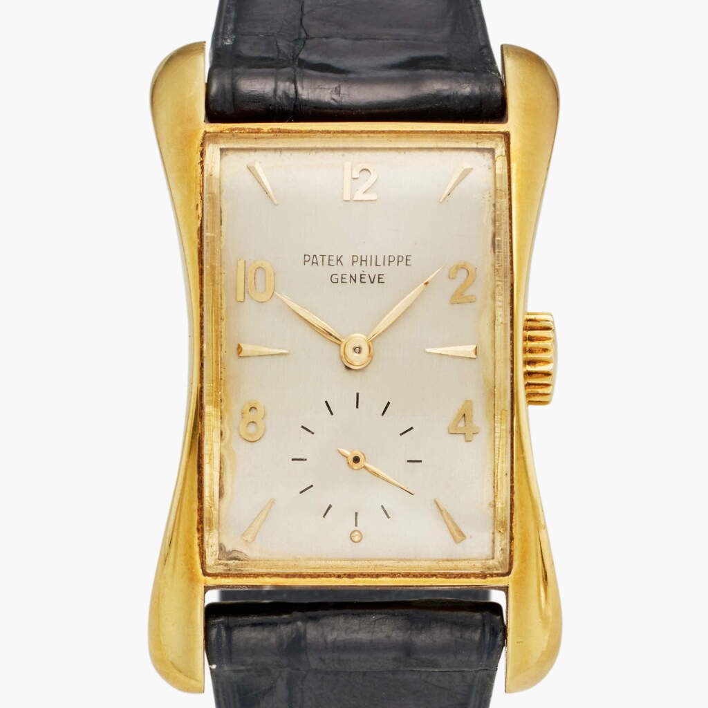 View full screen - View 1 of Lot 87. Reference 2442 'Marilyn Monroe' | Retailed by Serpico y Laino: A yellow gold rectangular wristwatch, Made in 1950.