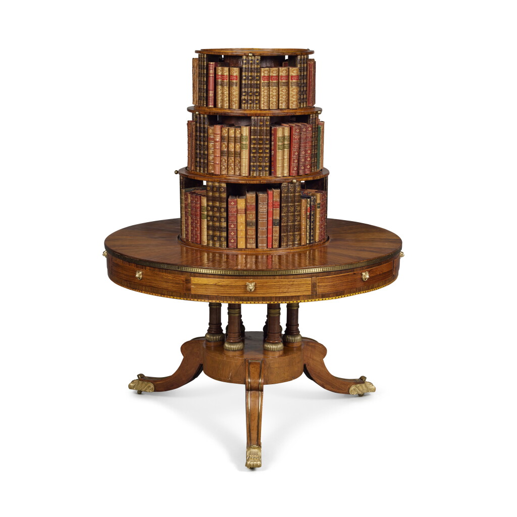 View full screen - View 1 of Lot 164. A Regency Gilt-Bronze Mounted and Brass-Inlaid Rosewood and Satinwood-Strung Drum Table and Bookstand, Circa 1810.
