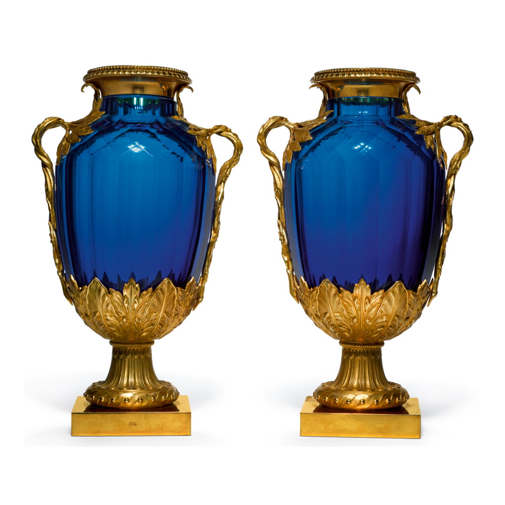 View full screen - View 1 of Lot 303. A PAIR OF MAISON ODIOT GILT BRONZE-MOUNTED BLUE GLASS LAURIER VASES, 20TH CENTURY.
