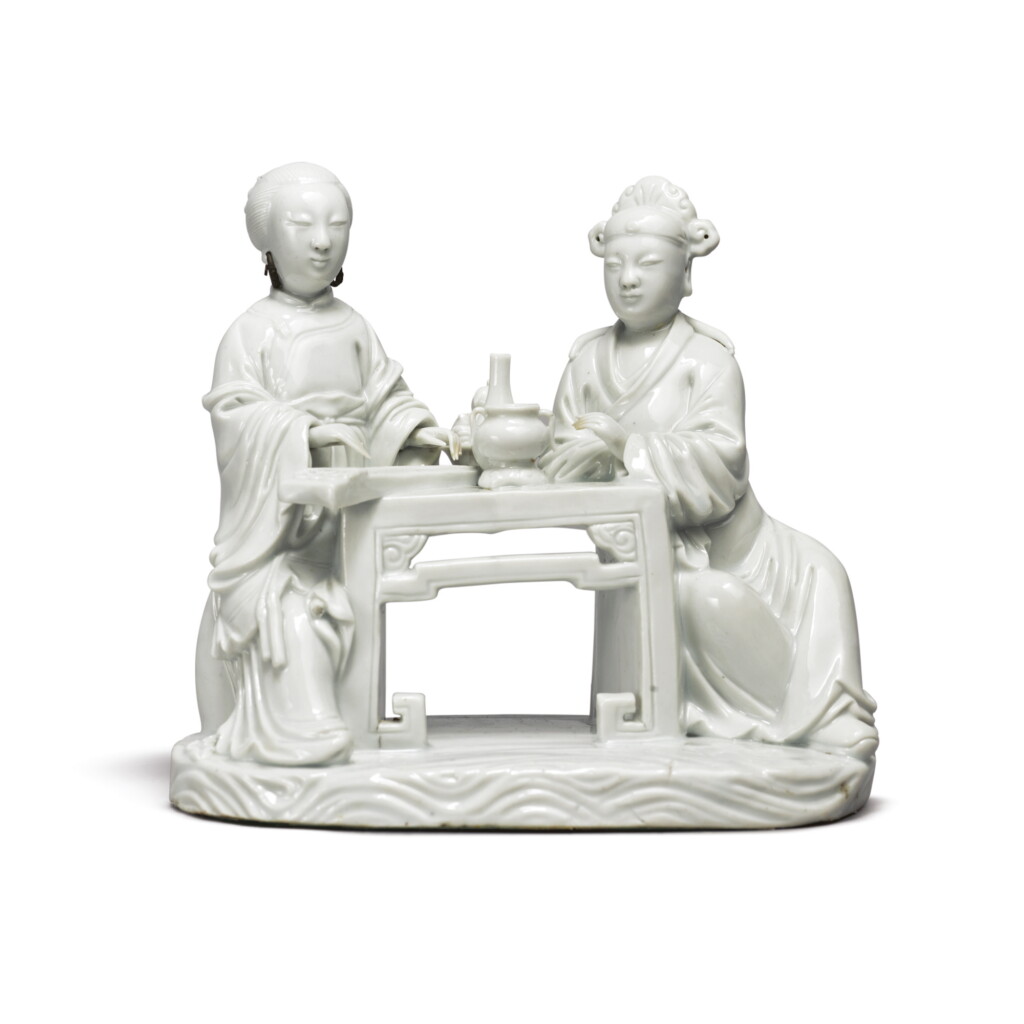 View full screen - View 1 of Lot 1026. A 'DEHUA' GROUP OF A SCHOLAR AND A COURTESAN PLAYING THE QIN, QING DYNASTY, 19TH CENTURY.