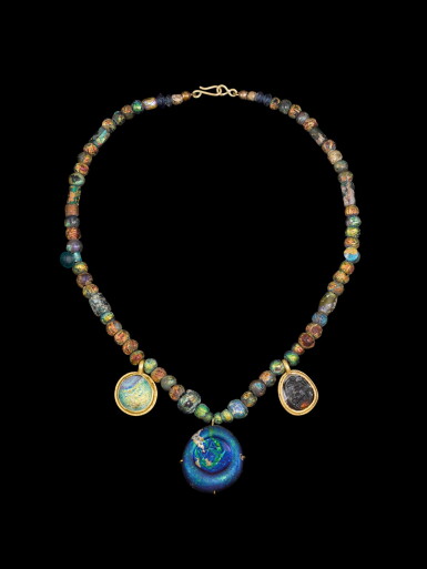 View full screen - View 1 of Lot 149. A Roman Glass Bead Necklace, circa 2nd/3rd Century A.D..