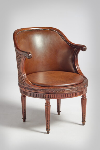 View full screen - View 1 of Lot 373. A Louis XVI Mahogany Caned Fauteuil de Bureau, Late 18th Century.