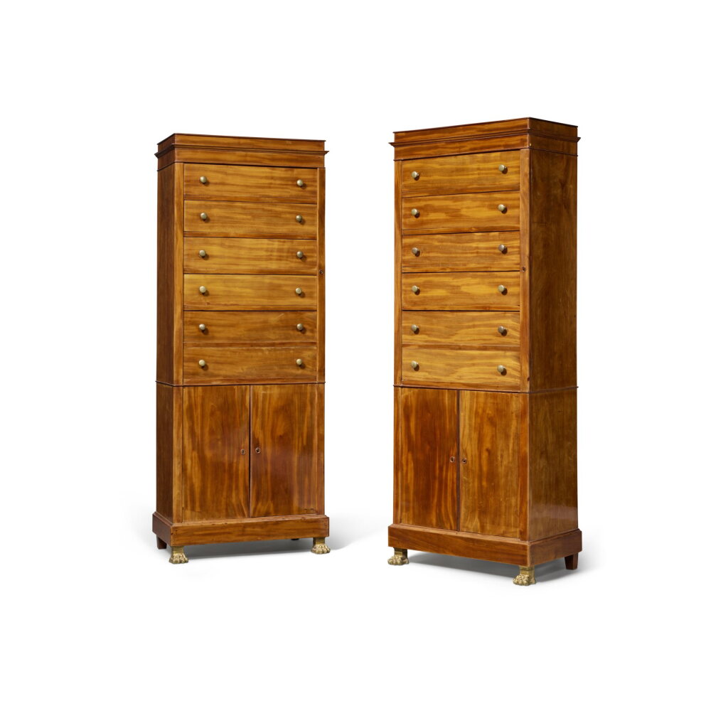 View full screen - View 1 of Lot 379. A Near Pair of Directoire Gilt-Bronze and Brass Mounted Mahogany Cabinets, Late 18th Century.