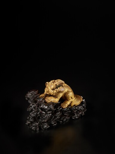 View full screen - View 1 of Lot 805. A gilt-bronze 'lion' paperweight, Ming dynasty | 明 銅鎏金獅形紙鎮 《宣德年製》款.