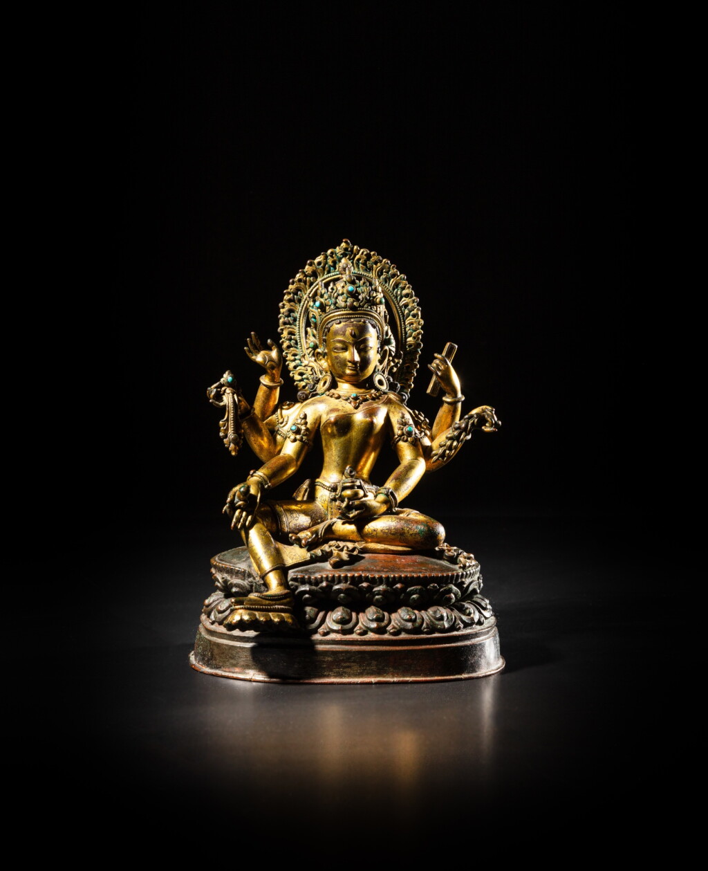 View full screen - View 1 of Lot 203. A turquoise-inlaid gilt-copper figure of Vasudhara, Nepal, 16th century | 尼泊爾 十六世紀 銅鎏金嵌寶毘財源天母坐像.