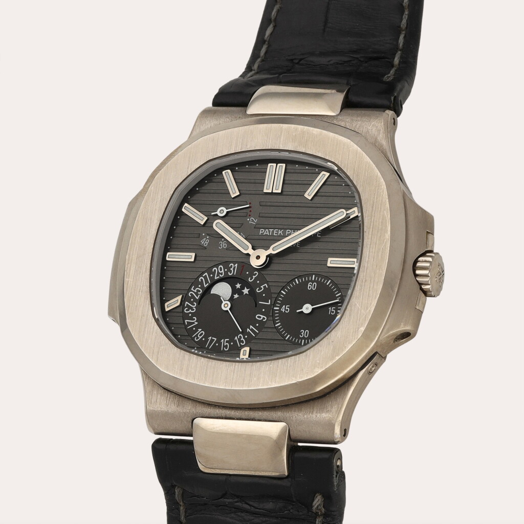 View full screen - View 1 of Lot 57. Nautilus, Reference 5712G | A white gold wristwatch with date, moon phases and power reserve indication | Circa 2010.