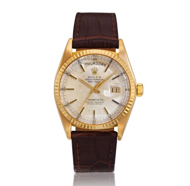 View full screen - View 1 of Lot 37. Reference 1803 Day-Date, Retailed by Tiffany & Co.: A yellow gold automatic wristwatch with day and date, Circa 1977 勞力士 1803型號 Day-Date 黃金自動上鏈腕錶備星期及日期顯示,約1977年製,零售商為蒂芙尼.