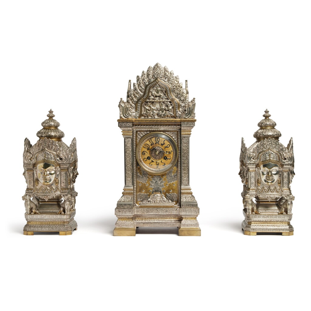 View full screen - View 1 of Lot 136. A French Brass Enameled and White Metal Clock Garniture, Late 19th century.
