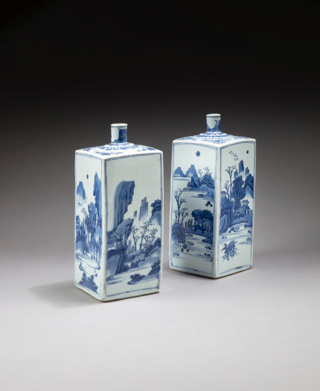 View full screen - View 1 of Lot 189. Two blue and white square 'landscape' bottle vases Transitional period | 明末清初 青花山水紋方瓶一組兩件.