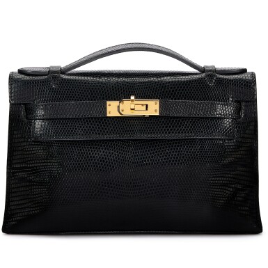 View full screen - View 1 of Lot 946. Black Shiny Niloticus Lizard Kelly Pochette Gold Hardware, 2010.