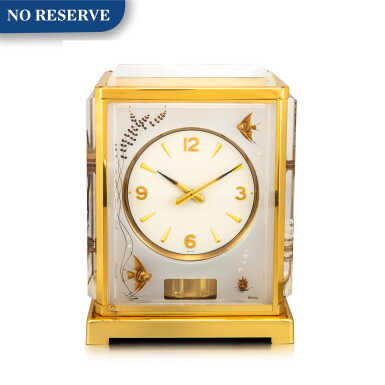 View full screen - View 1 of Lot 864. JAEGER-LECOULTRE | ATMOS, A GILT BRASS ATMOS CLOCK WITH ANGELFISH MOTIF PANELS ENGRAVED PERSPEX, CIRCA 1970.