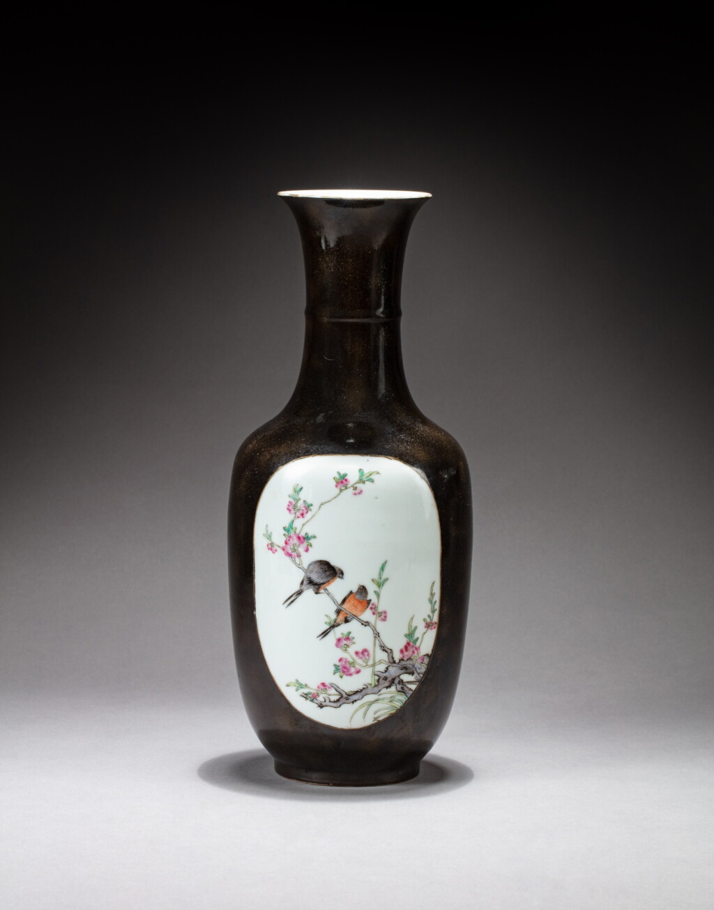 View full screen - View 1 of Lot 142. A gold-speckled black-ground famille-rose 'birds and flowers' vase, Qing dynasty, 19th century | 清十九世紀 黑地灑金粉彩開光花鳥圖瓶.