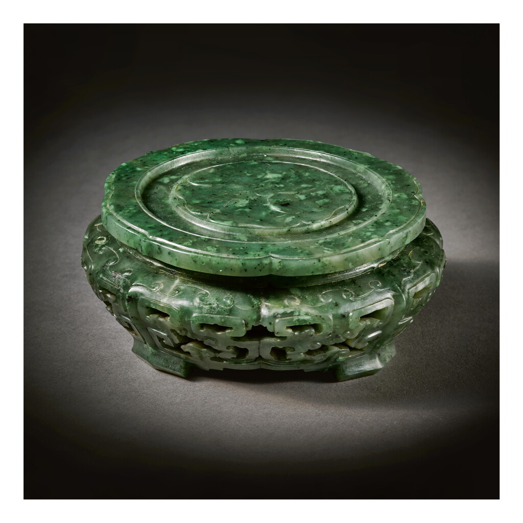 View full screen - View 1 of Lot 233. A RARE IMPERIAL SPINACH-GREEN JADE STAND, QING DYNASTY, QIANLONG PERIOD.