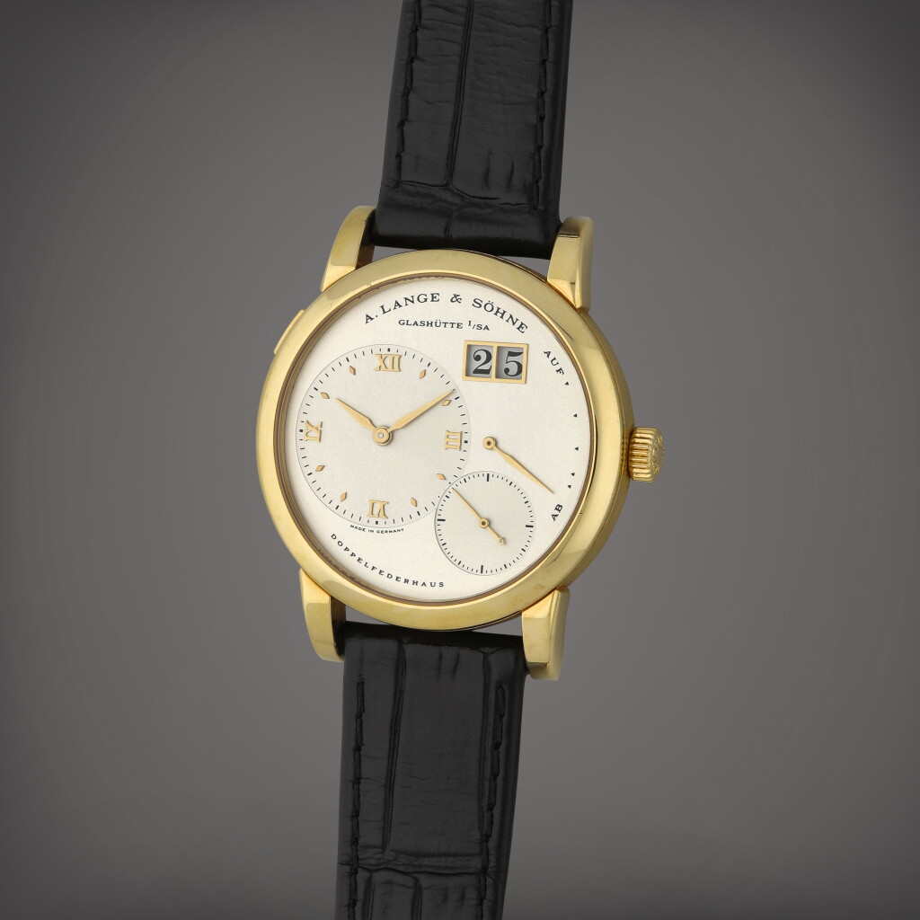 View full screen - View 1 of Lot 11. Lange 1, Reference 101.021 | A yellow gold wristwatch with digital date display and power reserve indication | Circa 1997.