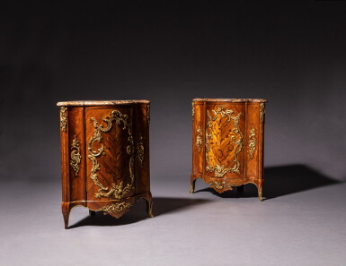 View full screen - View 1 of Lot 364. A pair of Louis XV gilt-bronze mounted kingwood and bois satiné veneered encoignures, stamped by Pierre Migeon | Paire d'encoignures en marqueterie de bois de violette et satiné, monture de brozne doré, d'époque Louis XV, estampille de Pierre Migeon.
