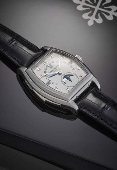 View full screen - View 1 of Lot 99. Reference 5013P | A platinum tonneau shaped minute repeating perpetual calendar wristwatch with retrograde date, moon phases and leap year indication, Made in 1999.